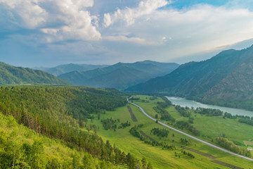 Naklejka na ściany i meble Summer mountains and the Altai river at sunset