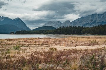 Isolated Peak and surrounding mountains and forests in Banff National Park in the Rocky Mountains in Alberta, Canada.
