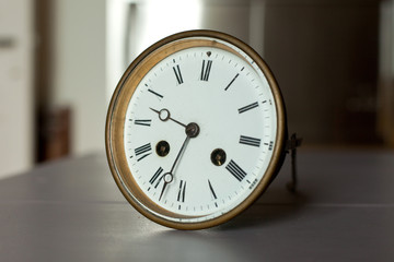 white vintage clock in classical design