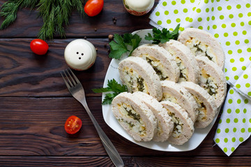 Meat roll (roulade) with egg and greens. Thanksgiving day appetizer. Top view flat lay background. Copy space.