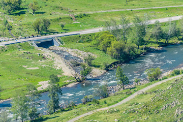 Mountain river in the Altai along the road