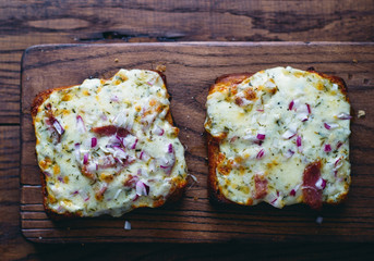 Hot homemade pizza sandwiches with mozzarella cheese, onion and sauce top view (the series #1)