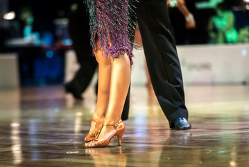 Dancing shoes feet and legs of female and male couple ballroom and latin
