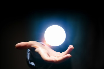 Fototapeta na wymiar Hand touching the moon