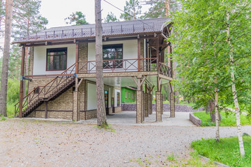 Fototapeta na wymiar Two-storey house for rest in the forest