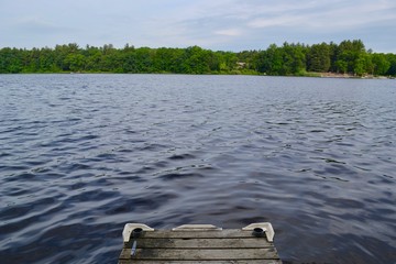 Running to jump off the end of a dock in Greenville, Michigan