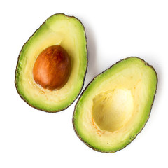 Avocado fruit close up. Two halves of avocado on white background.   Top view.