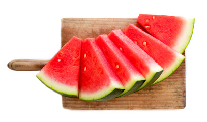 Slices of watermelon on cutting board  isolated on white background, top view. Refreshing watermelon. Summer concept.