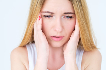 emotion face. worried upset unsettled unhappy woman. young beautiful blond girl portrait on white background.