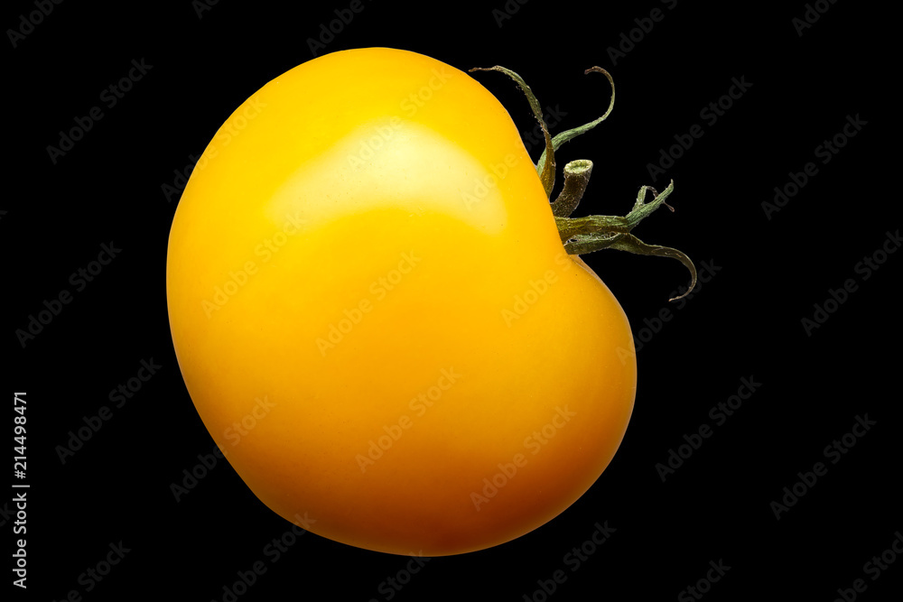 Wall mural delicious single yellow tomato isolated on black background with clipping path - Wall murals