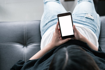 blank screen smartphone mock up.woman holding mobile phone with blank screen for insert graphic objects.chatting message with device.