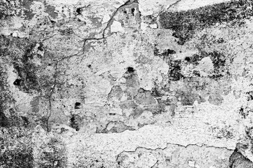 Wall fragment with scratches and cracks