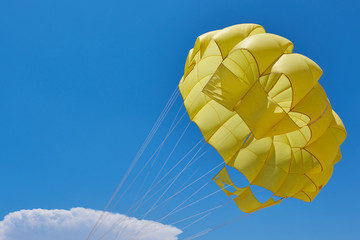 parachute on the background of the blue sky.