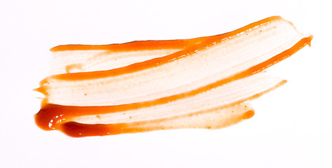 Tasty ketchup tomato sauce isolated over white background