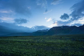 Foto op Canvas Iceland - Evening mood in mountainous landscape behind green lava fields © Simon