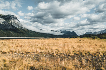 Isolated Peak and surrounding mountains and forests in Banff National Park in the Rocky Mountains in Alberta, Canada.