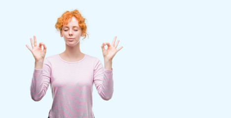 Young redhead woman relax and smiling with eyes closed doing meditation gesture with fingers. Yoga concept.