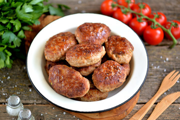 Homemade cutlets from minced pork and beef. Rustic food.