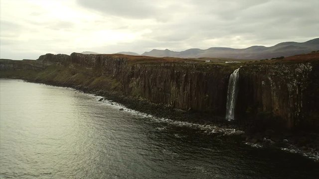 Aerial Pan of a Waterfall on the Cliffs of Skye Near Neist Point