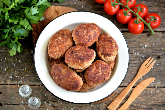 Homemade cutlets from minced pork and beef. Rustic food.