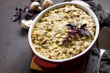 Baked potatoes with mushrooms and cheese on thanksgiving dinner table. Copy space.