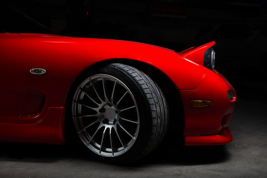 Fototapeta Car detailing series: Closeup of clean red sports car