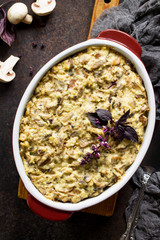 Baked potatoes with mushrooms and cheese on thanksgiving dinner table.