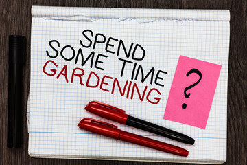 Word writing text Spend Some Time Gardening. Business concept for Relax planting flowers fruits vegetables Natural Color pen on written notepad with question mark black marker on woody deck.