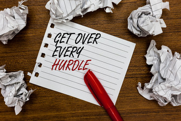 Conceptual hand writing showing Get Over Every Hurdle. Business photo showcasing Overcome any obstacle problem trouble adversities Written white page touched red marker scattered paper lump.