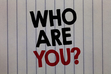 Handwriting text writing Who Are You question. Concept meaning Identify yourself description personal characteristics white vertical paper written three words with black and red color.