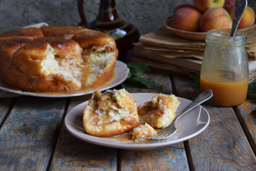 Caramel monkey bread. Apple pie with brown sugar and cinnamon on a wooden background. Autumn baking. Homemade sweets. Rustic style. Copy space.