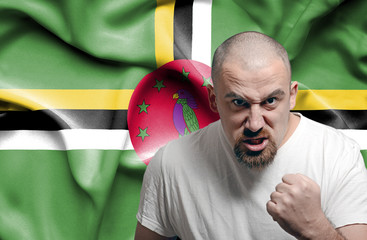 Angry man against flag of Dominica