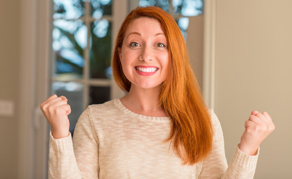 Redhead Woman At Home Screaming Proud And Celebrating Victory And Success Very Excited, Cheering Emotion