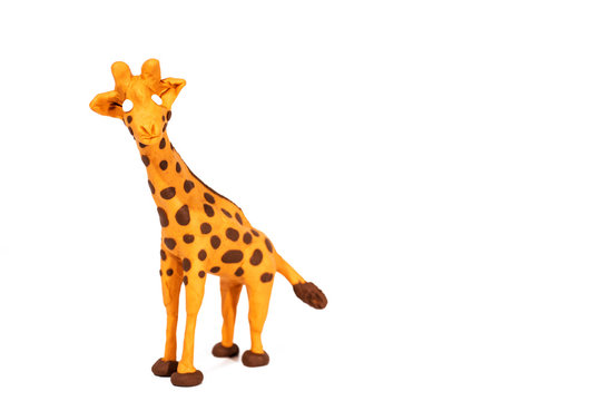 Plasticine artwork. Handmade giraffe. Abstract isolated photo.