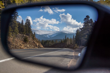 Mountain view in the car mirror