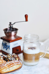 jar of coffee, coffee mill and desserts