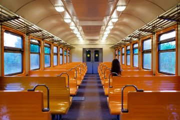 Woman sitting alone in public train.