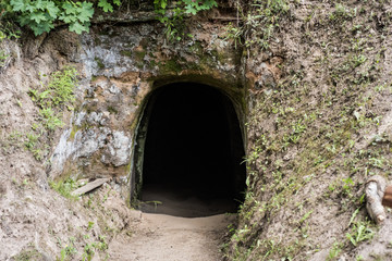 Small cave in mountain. Dark enter.