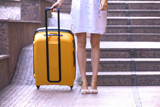 Girl traveler and suitcase