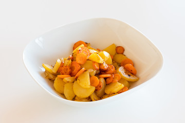 tasty meal on white background. potatoes and carrots served