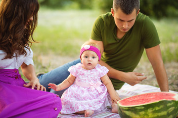 little girl looking at camera during picnic in the park