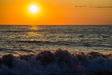 Amazing sea sunset, the sun, waves, clouds