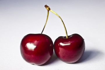 Pair of Fresh Sweet cherries isolated on white background