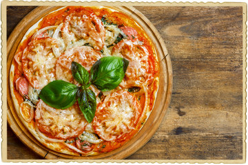 Colorful pizza with mozzarella cheese, chicken, sweet pepper and parsley close up top view. Italian...