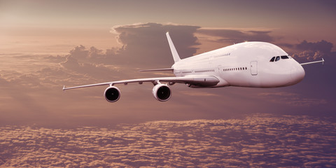 Fototapeta na wymiar Big commercial airplane flying above dramatic clouds.
