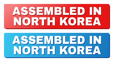 ASSEMBLED IN NORTH KOREA text on rounded rectangle buttons. Designed with white caption with shadow and blue and red button colors.