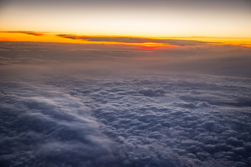 Fototapeta na wymiar Sunrise sky from the airplane window