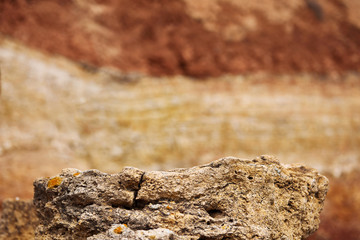 closeup of stone on the beach, sea coast with high hills, beautiful wild landscape