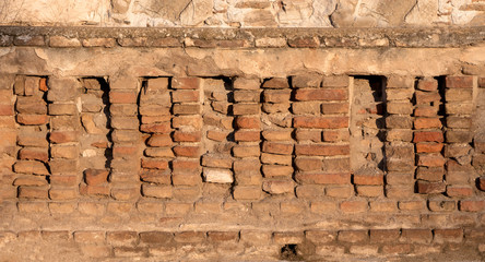 Wall with red  bricks closeup, background/ texture.