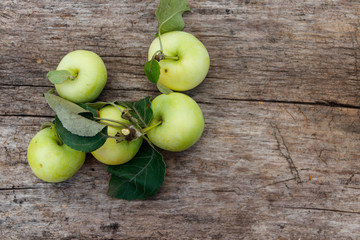 Fresh ripe apples on rustic wooden table